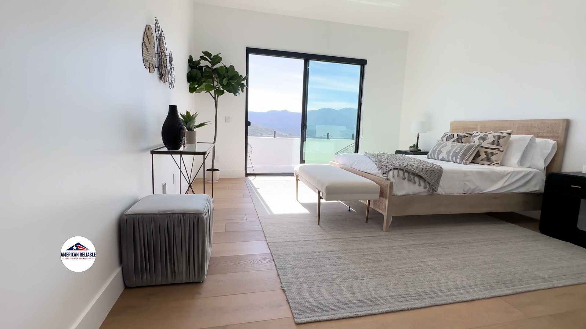 Modern bedroom with mountain views and balcony access