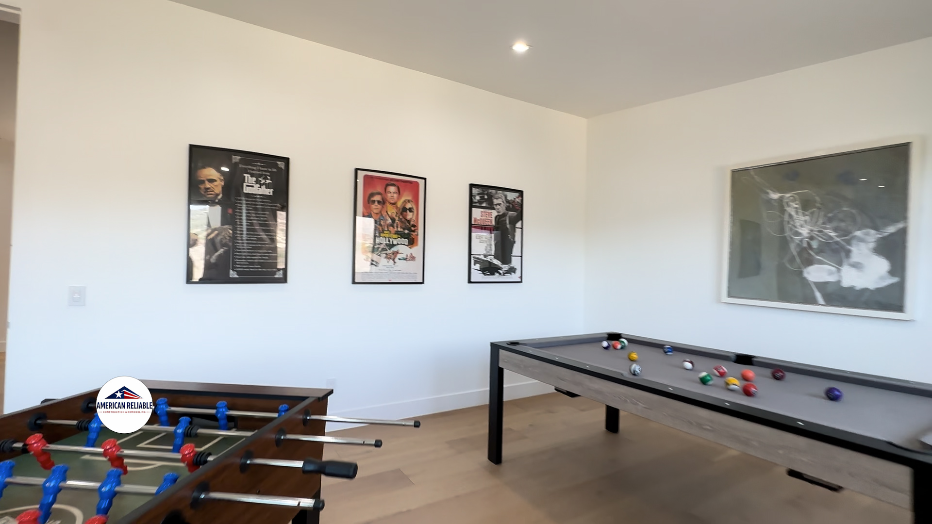 Game room with movie poster collection