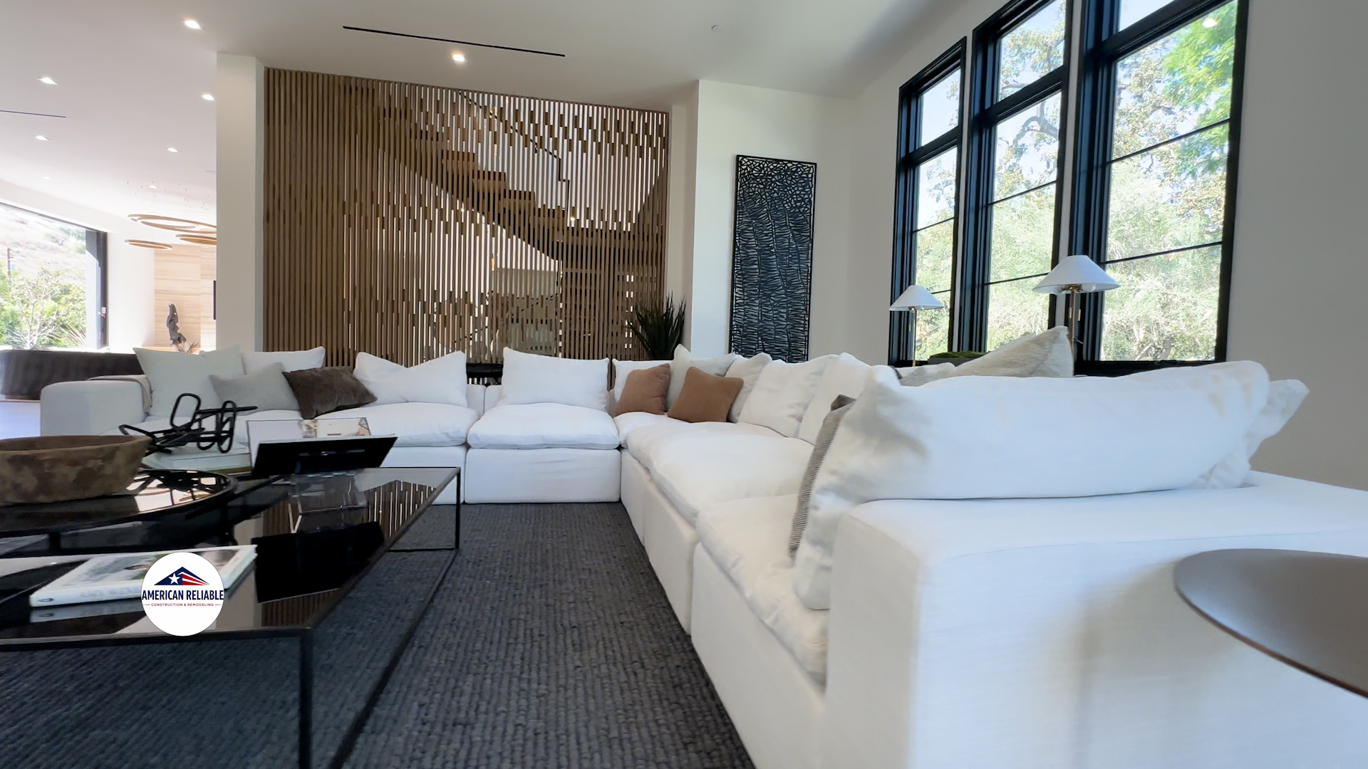 Spacious living room with custom wood slat accent wall