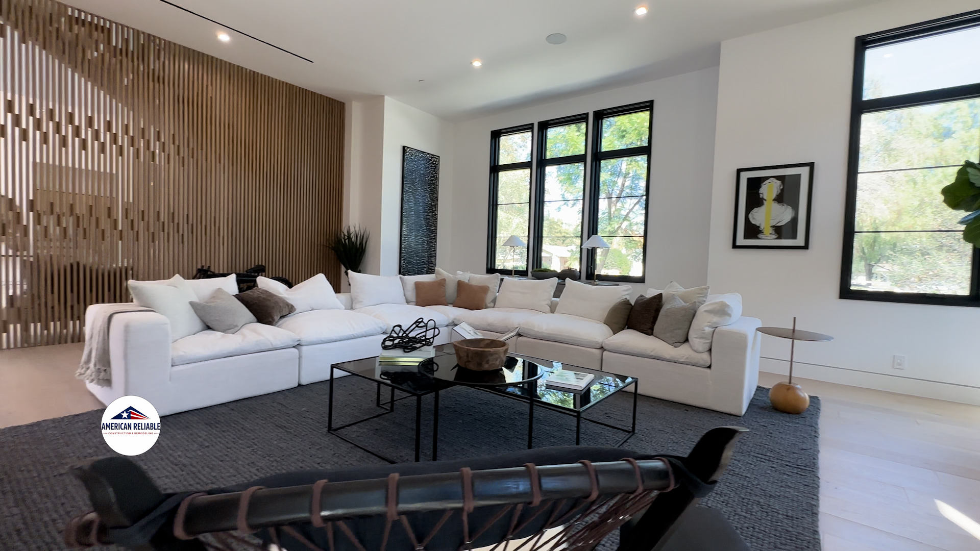 Open plan living area with decorative wood screen