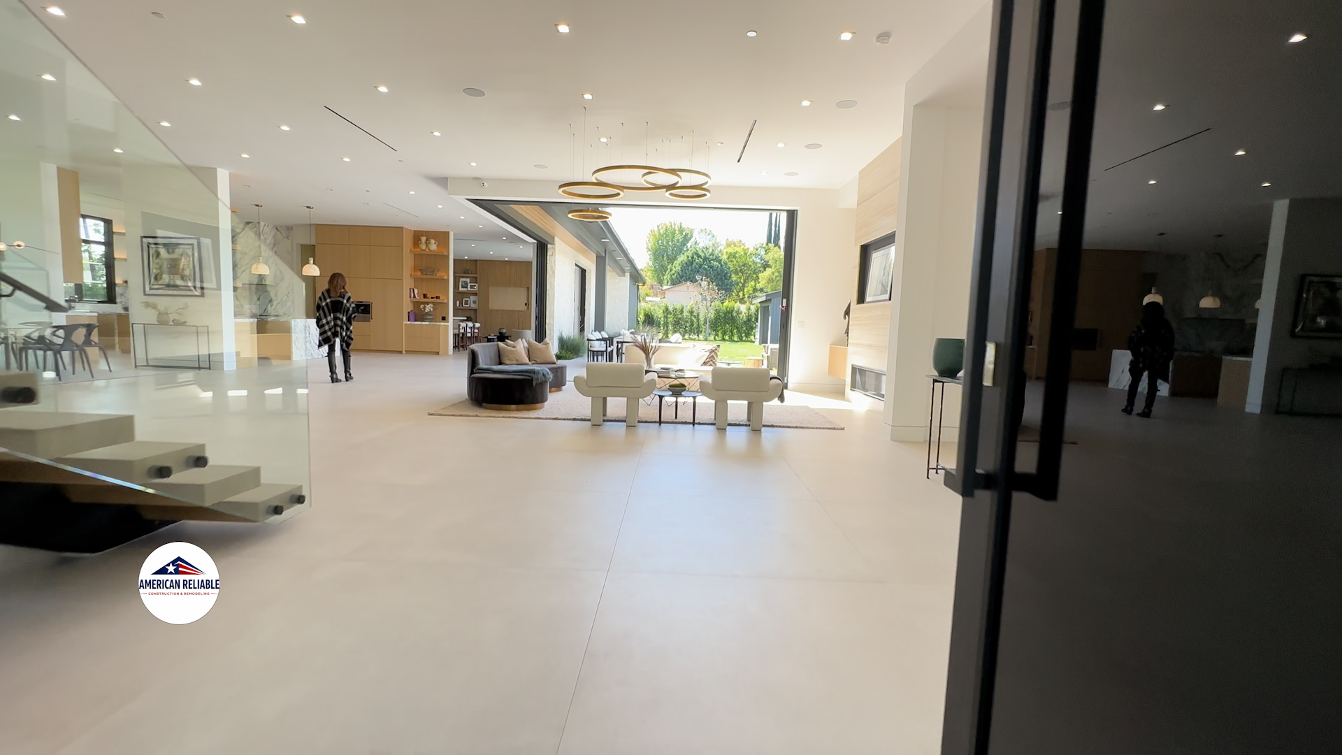 Grand open concept living with ring chandelier