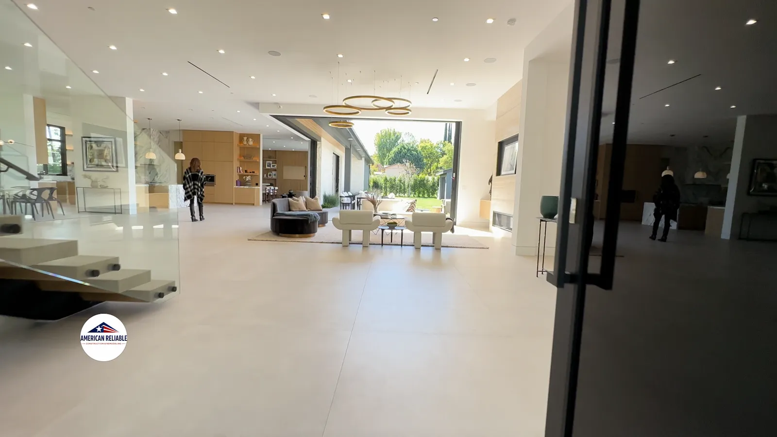 Grand open concept living with ring chandelier