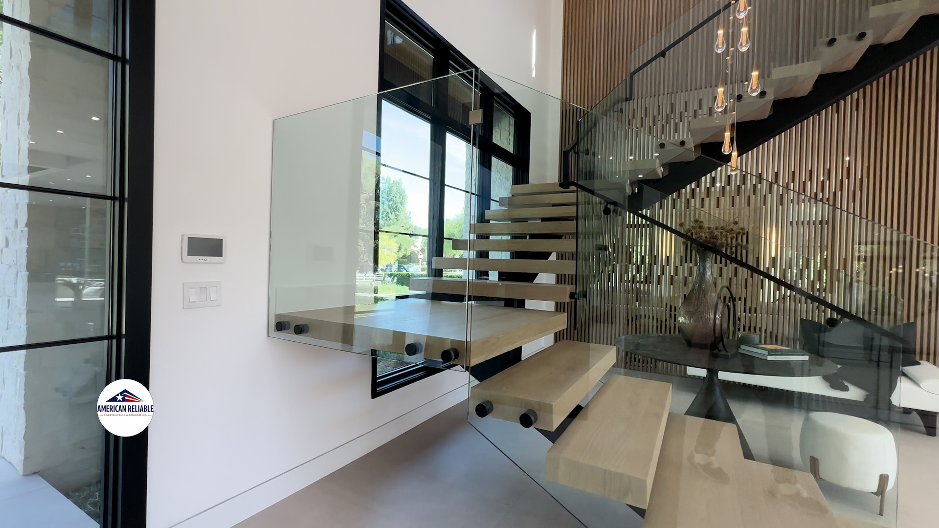 Floating oak staircase with glass railing