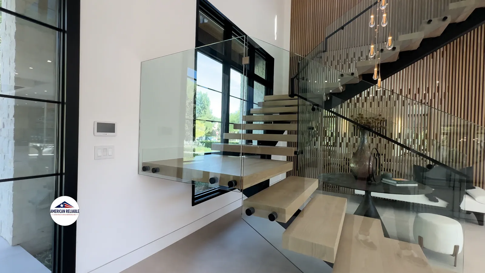 Floating oak staircase with glass railing